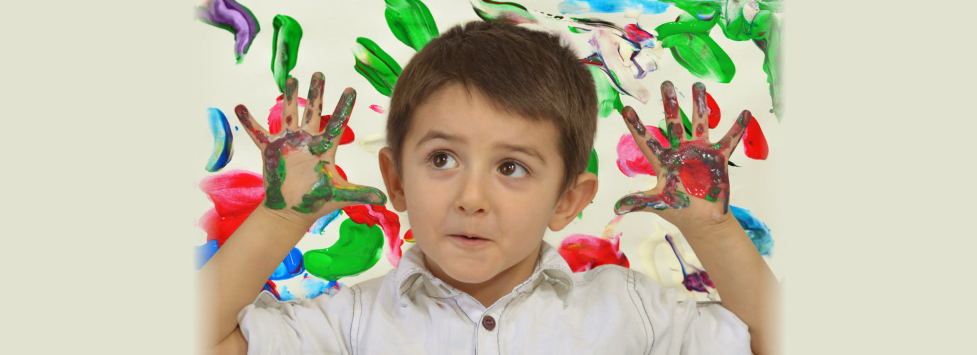 boy with paint on hands